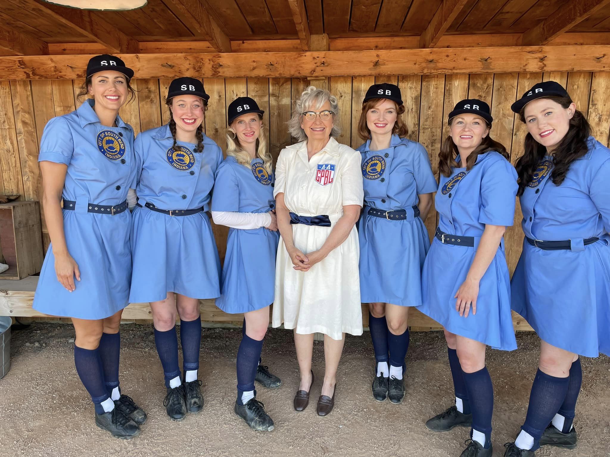 A group of women in 1950s baseball clothes